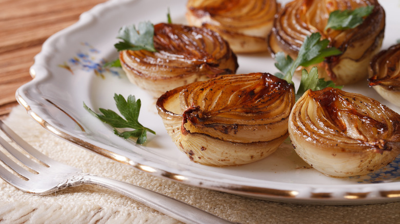 Roasted onions with fork