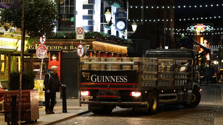 A Guinness truck driving through Temple Bar in Dublin