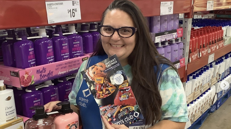 Sam's Club shopper holding booklet