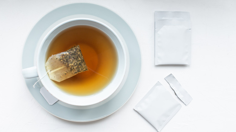 Cup of tea with a tea bag in it.