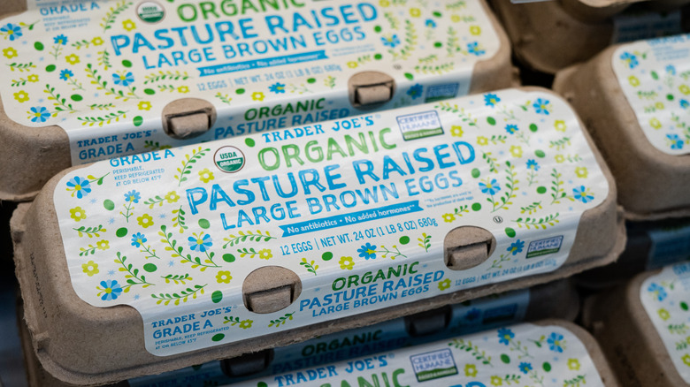 Cartons of Trader Joe's organic, pasture-raised eggs in a store display