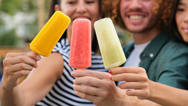 people enjoying fruity ice cream bars