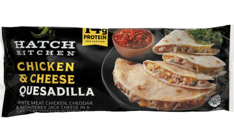 The front of an elongated plastic package displaying chicken & cheese quesadillas