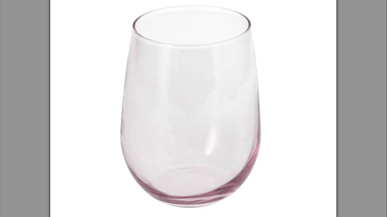 Stemless wine glass with a pink tint