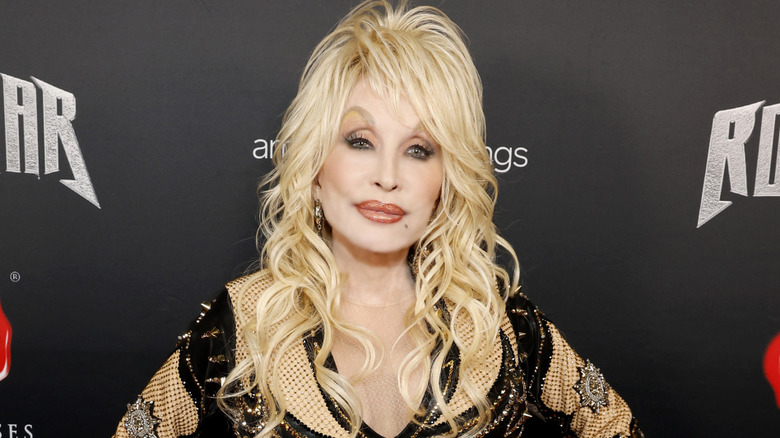 Dolly Parton in a black dress with sequins