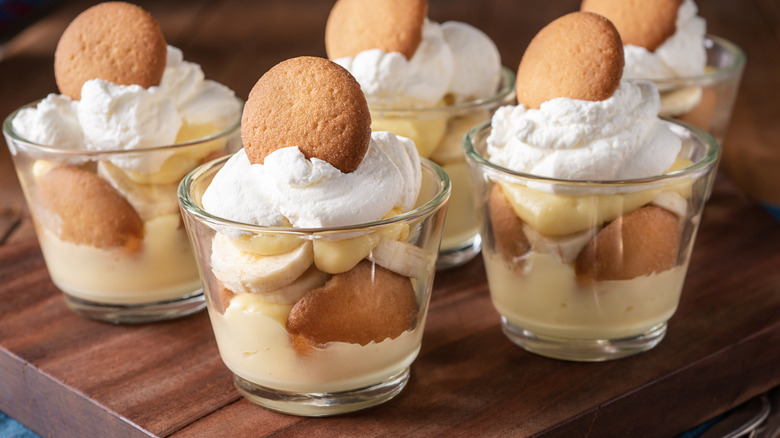 cups of banana pudding on wood table