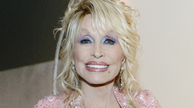 Closeup of Dolly Parton smiling for a photo