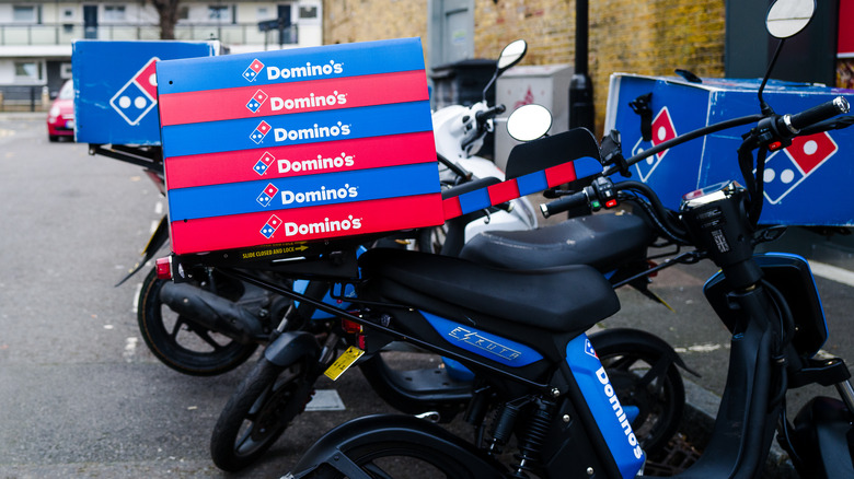 Domino's pizza boxes stacked to be delivered