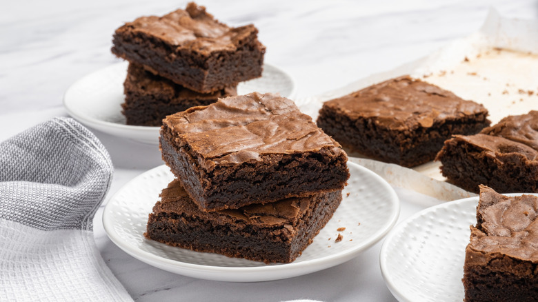 brownie slices on white plates