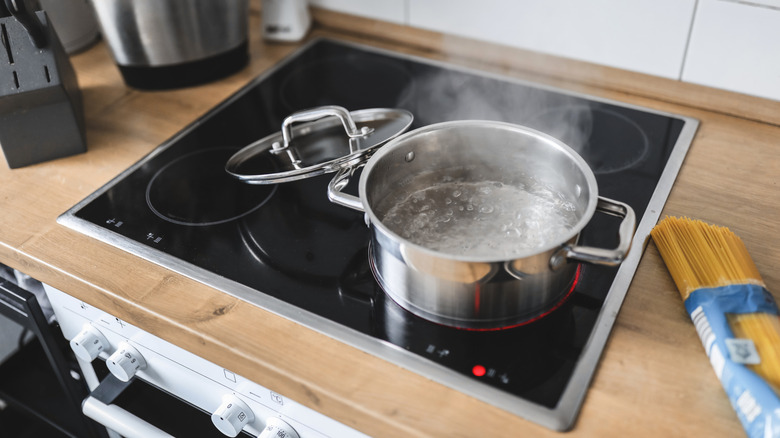 Induction stove with boiling pot.