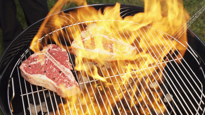 Steaks in grill flare up