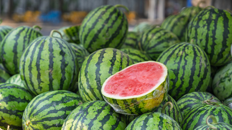 Closeup view of watermelons in a pile at the store