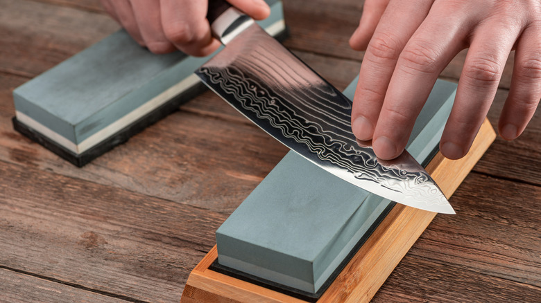 a knife sharpening on a whetstone