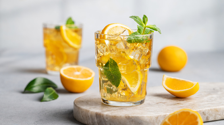 Lemon mocktail surrounded by lemons