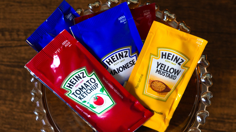 Packets of condiments in a bowl