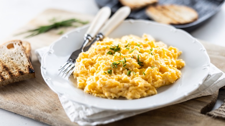 plate of scrambled eggs with toast
