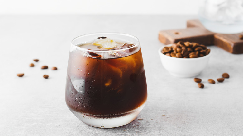 Coffee cocktail in glass with coffee beans