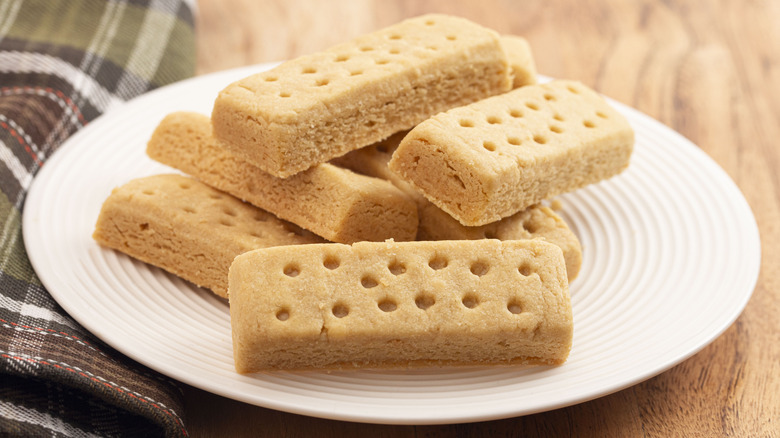 A close up on rectangular pieces of shortbread with holes