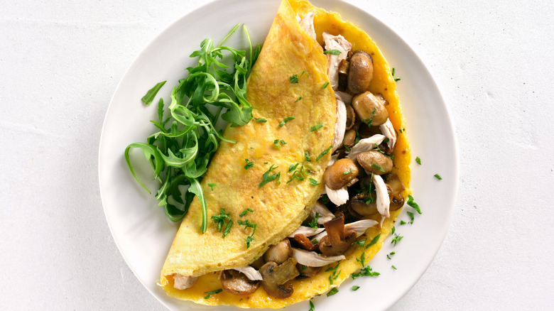 Omelet with shredded chicken and mushrooms