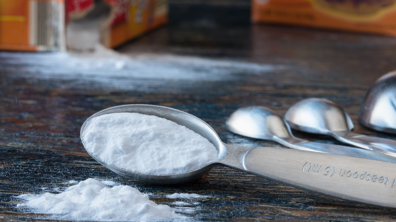 Spoons and spilling boxes of baking soda