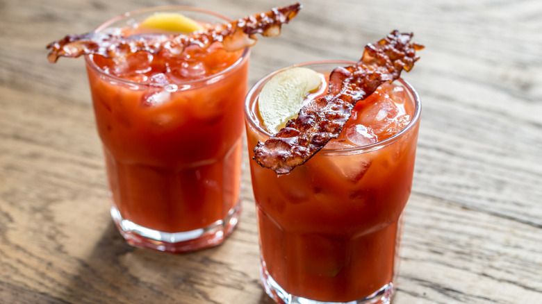 Bloody Mary cocktails with bacon strips