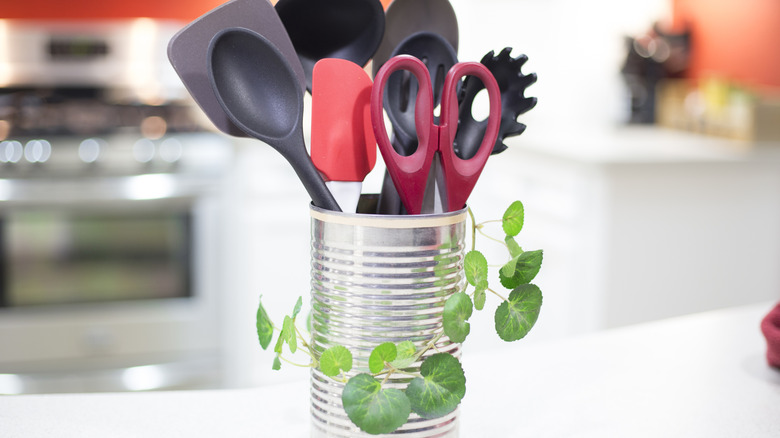 Repurposed aluminum tomato can on a kitchen counter