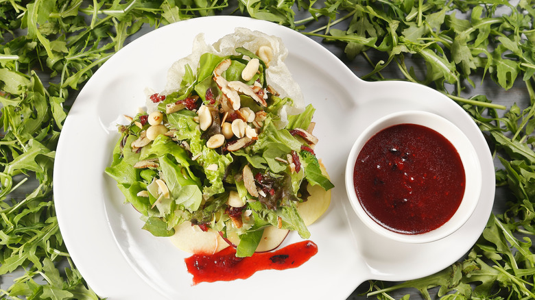 Salad with cranberry vinaigrette and walnuts