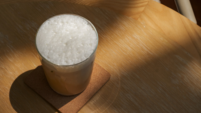 An iced coffee topped with cold foam