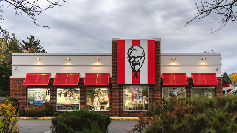 KFC restaurant in front of cloudy sky