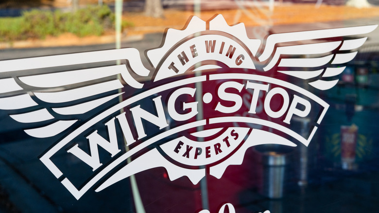 Wing Stop Restaurant Logo Displayed Prominently On Storefront Glass Exterior
