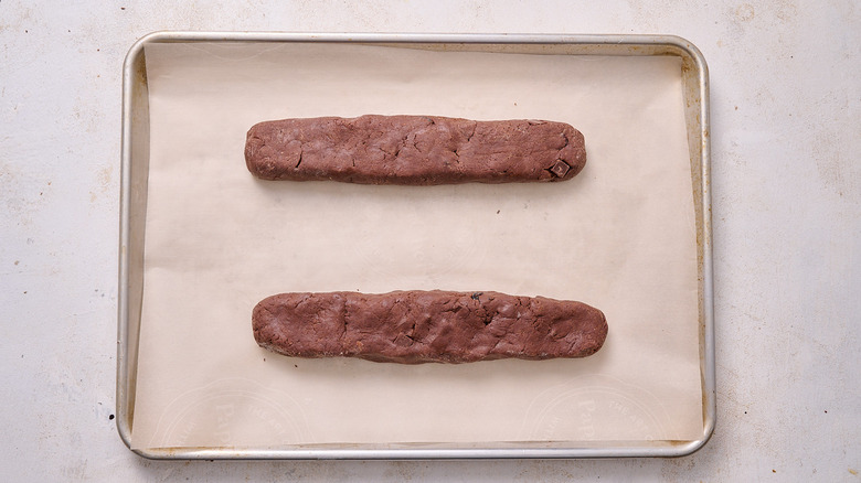 biscotti logs on a baking sheet