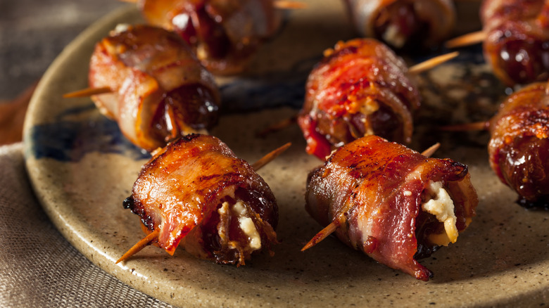 bacon wrapped dates on plate