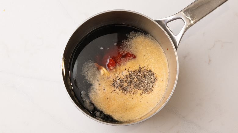 sauce ingredients in a pan on marble surface