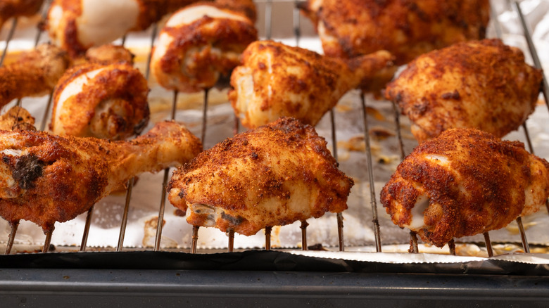 close up of cooked chicken on wire rack