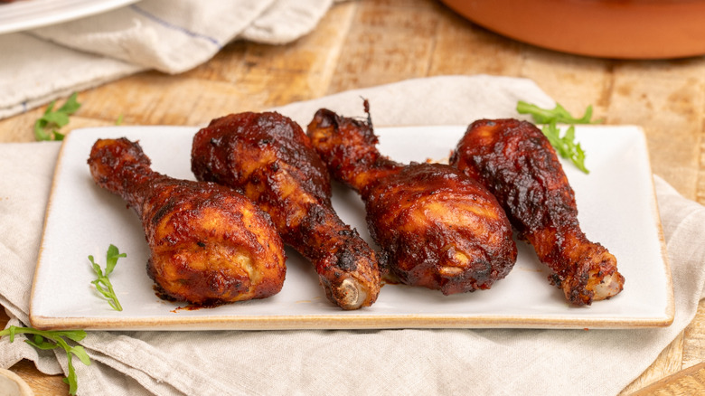 Cooked Dr Pepper barbecue chicken arranged on dish