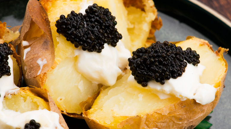 Baked potatoes with caviar and crème fraîche