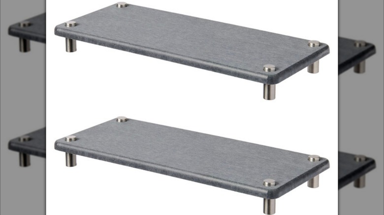 Two Aldi stone drying mats on a white background