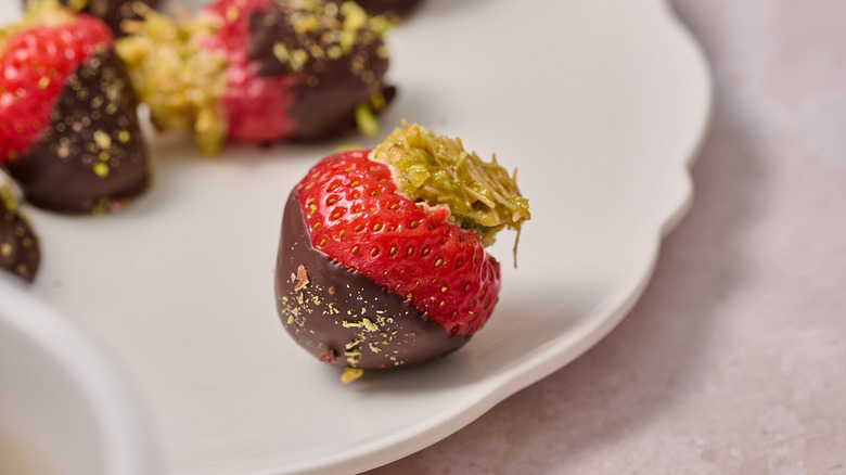 chocolate covered strawberry on a plate