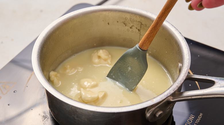 stirring chocolate in a saucepan
