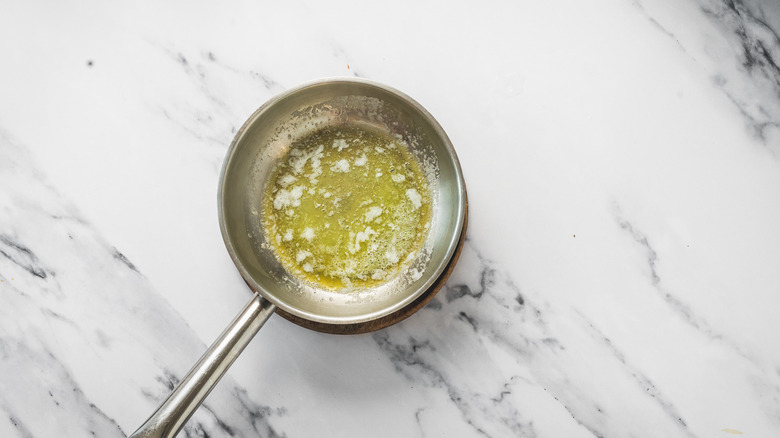 Pan with melted butter.