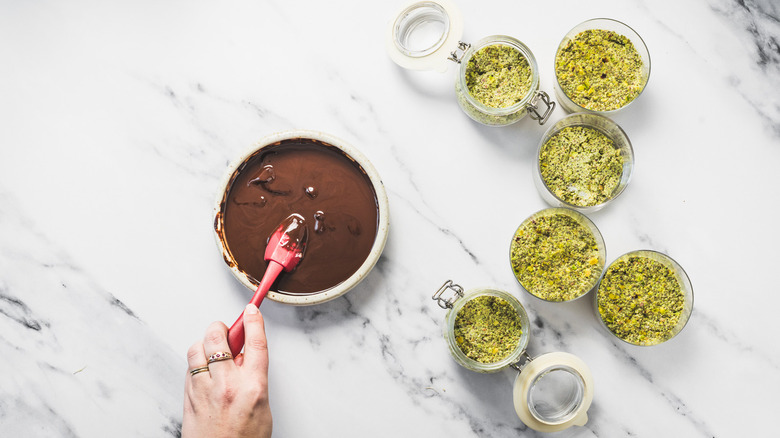 Stirring chocolate with a spatula.