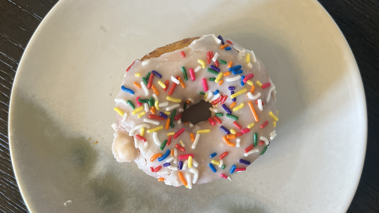 Duck Donuts Vanilla Confetti donut on plate.