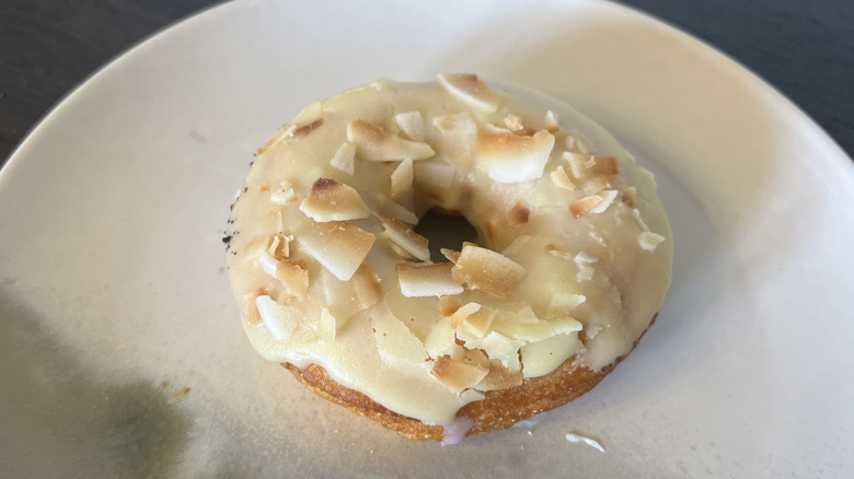 Duck Donuts Lemon Coconut donut on plate.