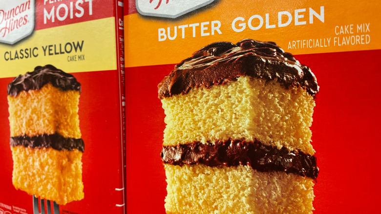 Boxes of Duncan Hines cake mix on a shelf at a store