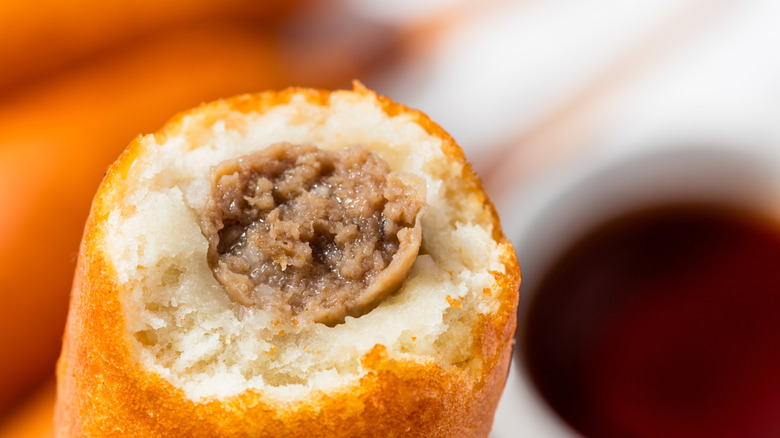 Sausage stuffed pancake with maple syrup