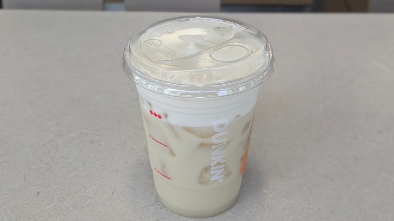 A Suncloud Lemonade from Dunkin' on a grey table