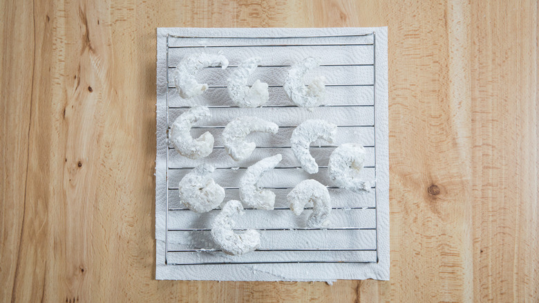 cornstarch-coated shrimp on wire rack