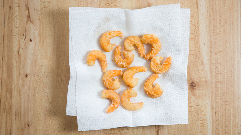 fried shrimp on paper towels