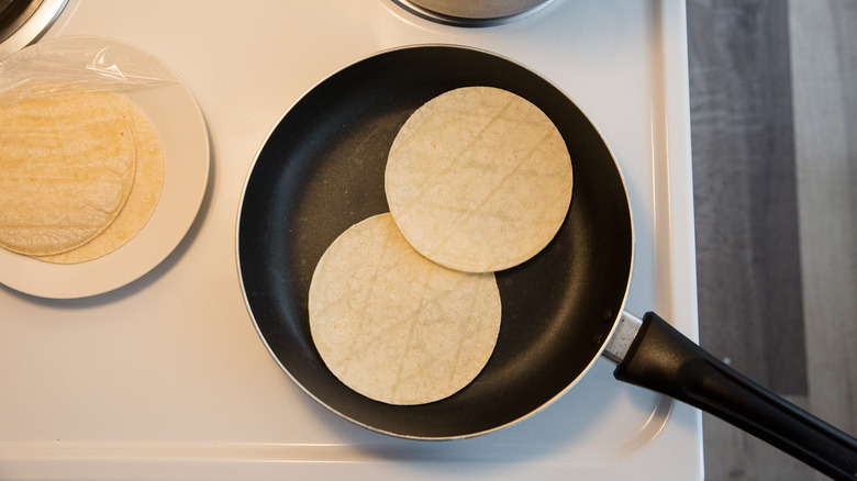 tortillas warming in frying pan