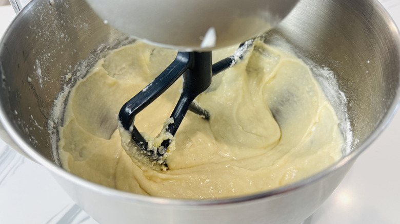 white cake batter in a stand mixer bowl